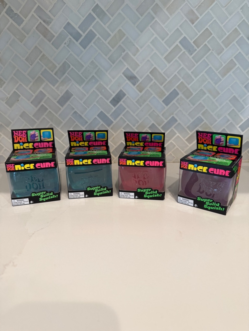 Nee Doh Nice Cube Squish Toy Set - Teal, Green, Pink, Purple
